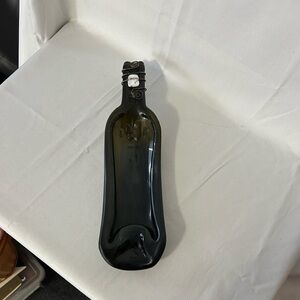 Unique recycled slumped/melted glass bottle design as a serving dish/spoon rest